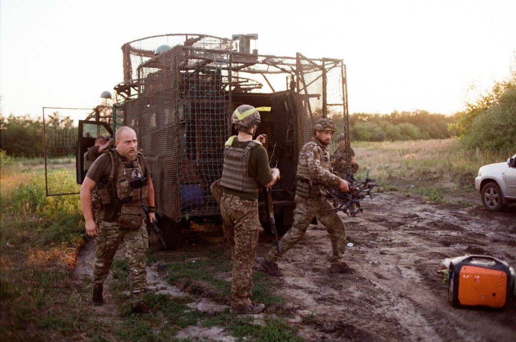 Soldiers unload gear as they come off positions. Ukraine, August 2025. Photo by Lucile Brizard/UNITED24 Media.