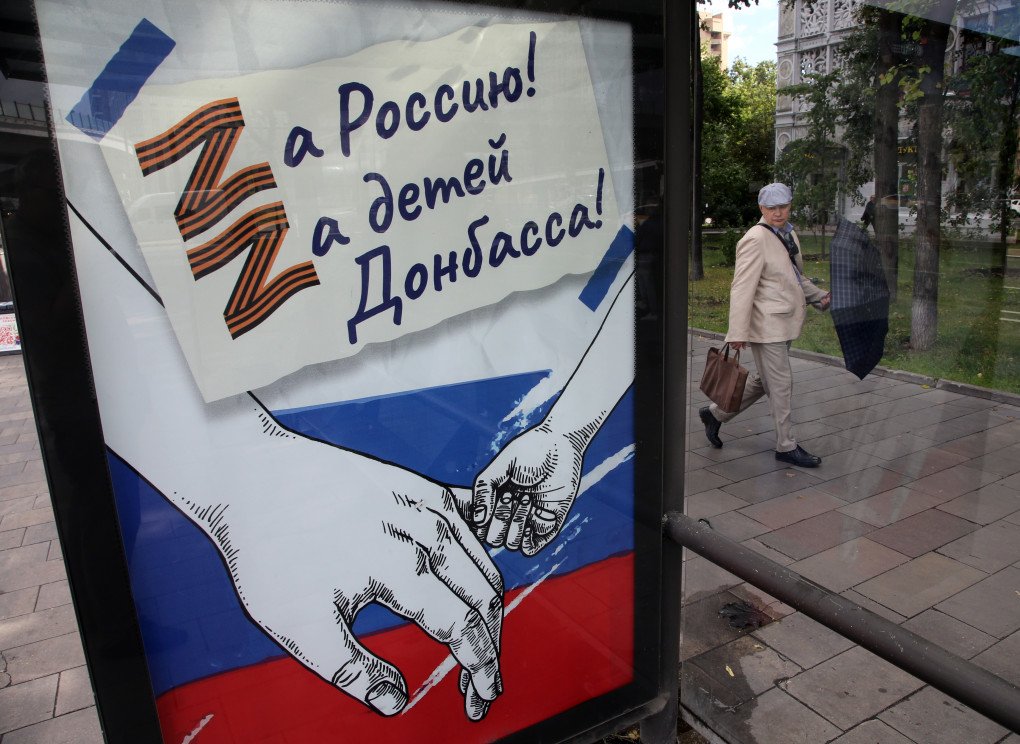 A bus stop banner extolls the military invasion of Ukraine July 21, 2022 in Moscow, Russia. The sign translated reads "For Russia! For childen of Donbas." The letter "Z" became the propaganda symbol of support for Russian troops in the invasion that began in February. (Photo by Contributor via Getty Images)
