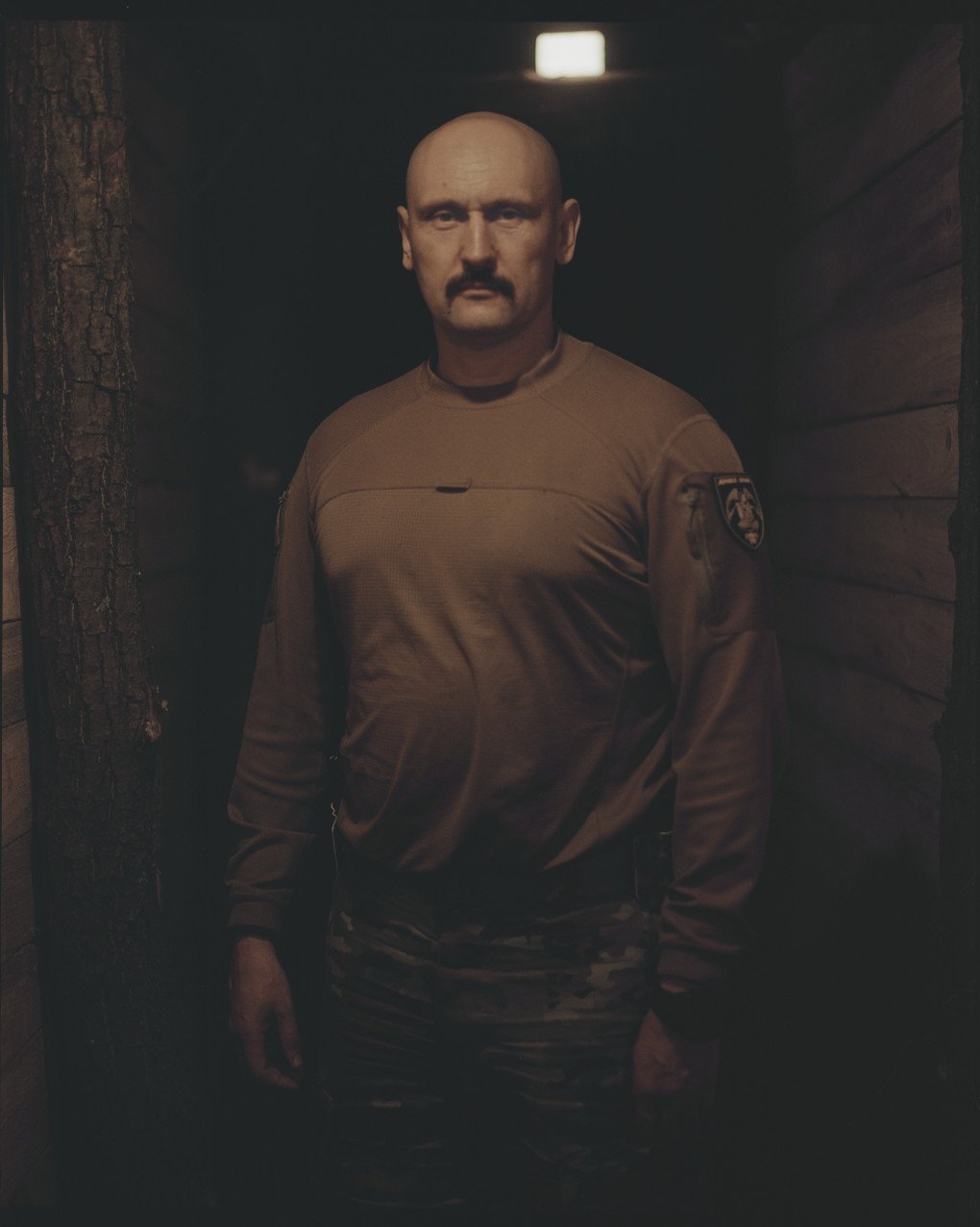 Dmytro “Perun” Filatov, 1st Separate Assault Regiment, poses for a picture in a command center. Photo by Joshua Olley/UNITED24 Media