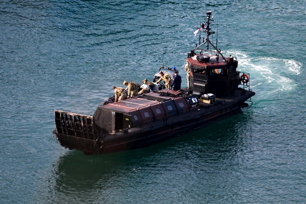 Military personnel are seen at Portland Port at the Smyrtos vessel is held outside the harbour, on June 14, 2026 in Portland, England. An oil tanker operating as part of Russia's shadow fleet has been intercepted by British Forces in the English Channel. (Photo by Finnbarr Webster via Getty Images)