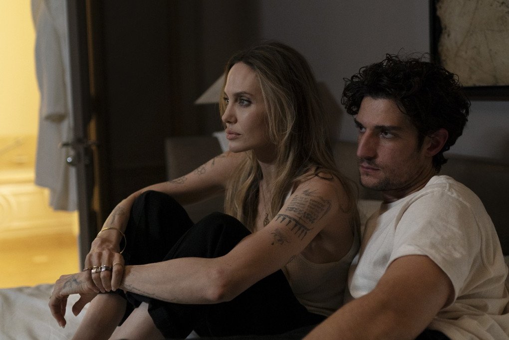 Angelina Jolie portrays Maxine, an American director navigating personal upheaval, alongside Louis Garrel in Alice Winocour's feature film “Couture.” (Source: Green Light Films)