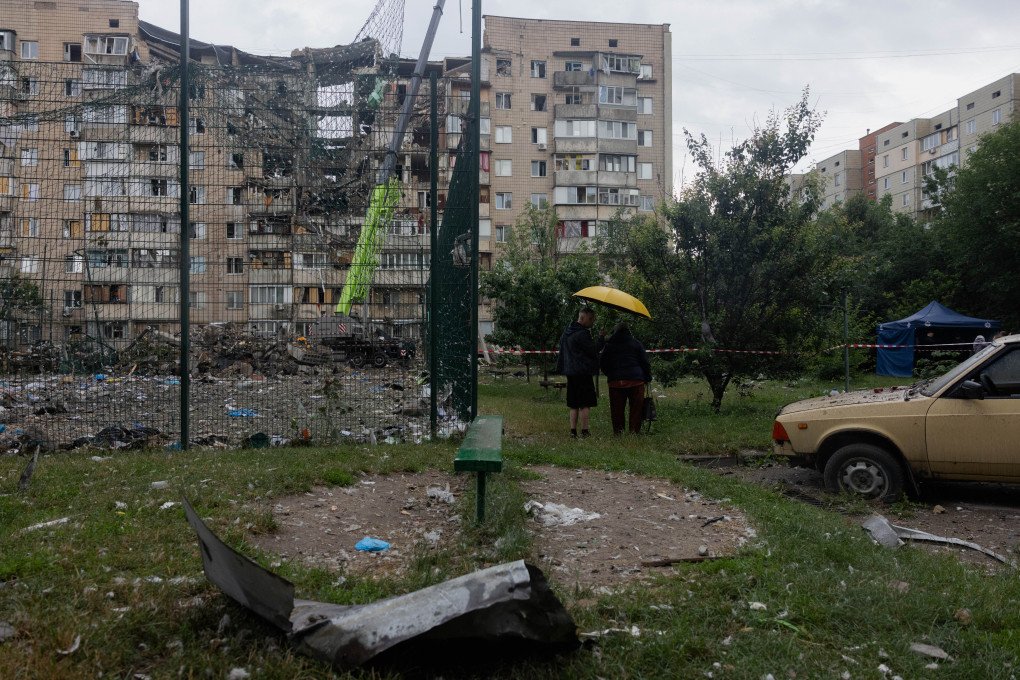 Local residents look at a damaged residential building following a Russian missile strike on the Ukrainian capital of Kyiv on July 6, 2026, amid the Russian invasion in Ukraine. (Photo by Tetiana DZHAFAROVA / AFP via Getty Images) Local residents look at a damaged residential building following a Russian missile strike on the Ukrainian capital of Kyiv on July 6, 2026, amid the Russian invasion in Ukraine. (Photo by Tetiana DZHAFAROVA / AFP via Getty Images)