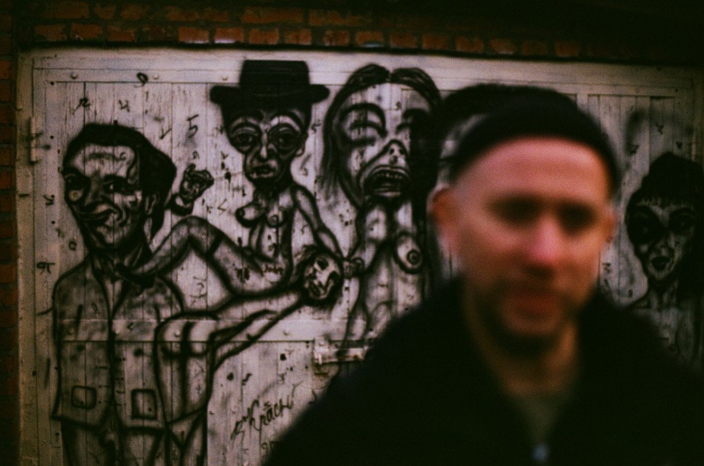 Ukrainian photographer Vladyslav Krasnoshchok, in front of one of his murals paiting, in his Kharkiv house-museum, November 28, 2025. (Source: Louis Beaudemont / UNITED24 Media)