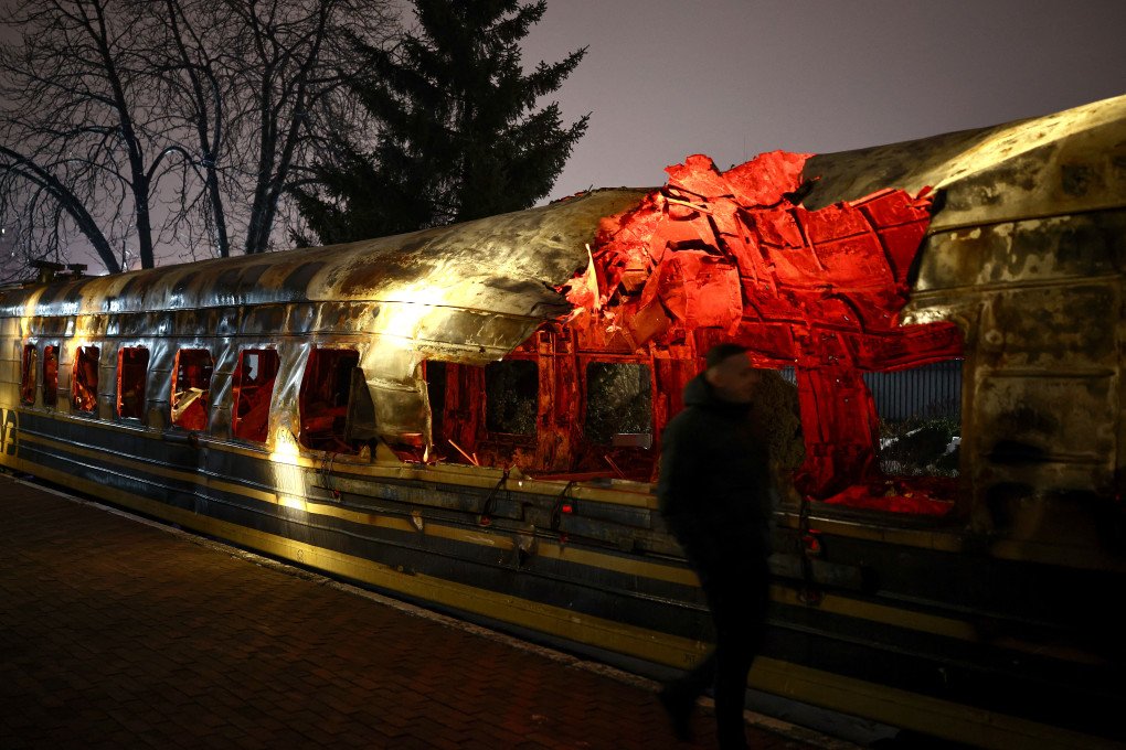 A Ukrainian railway carriage that was attacked by a Russian drone on January 27, 2026 near Kharkiv in eastern Ukraine killing six people, on display at the Kyiv central train station on February 23, 2026, ahead of the fourth anniversary of Russia's invasion of Ukraine. (Photo by HENRY NICHOLLS / AFP via Getty Images)