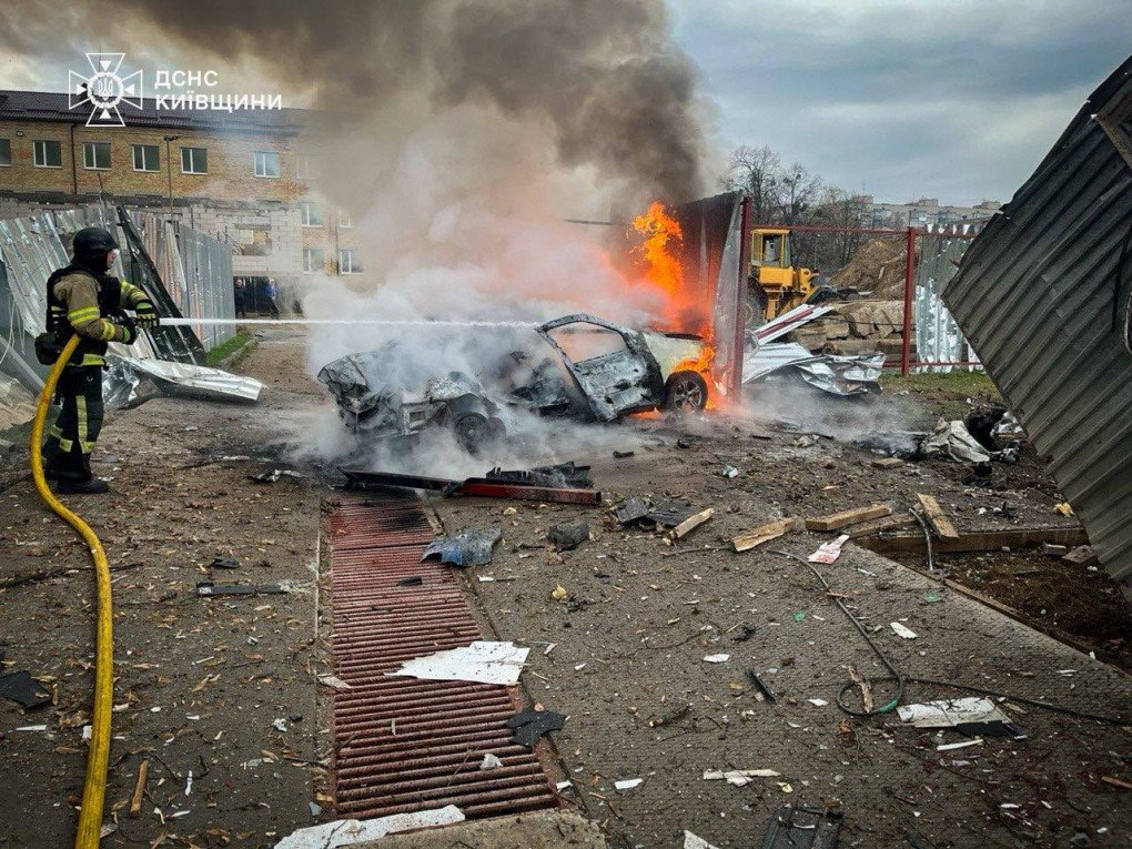 Firefighters extinguishing a vehicle fire caused by the Russian attack in the Kyiv region, Ukraine on April 3, 2026. (Source: State Emergence Service)