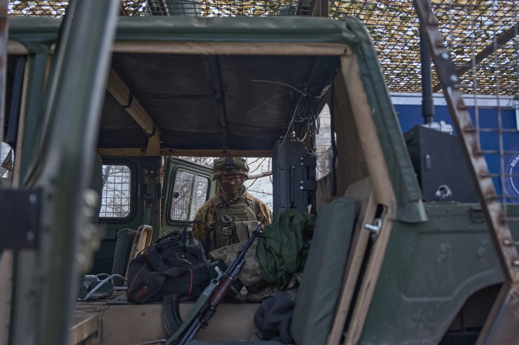 The fierce gaze of a foreign fighter through the Humvee’s cabin. The fierce gaze of a foreign fighter through the Humvee’s cabin.