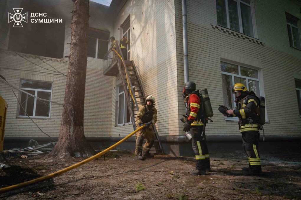 Rescuers prepare hoses outside the kindergarten, struck by Russian drones in central Sumy. (Source: State Emergency Service of Ukraine)