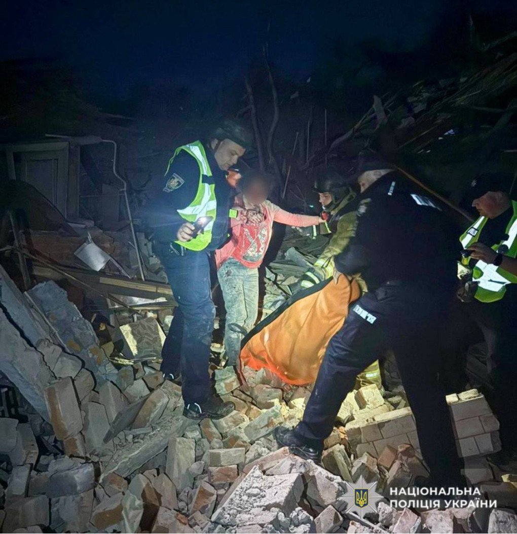 Police rescue a civilian after a Russian combined drone and missile strike on Ukraine on May 25, 2025. (Source: Ukrainian National Police)