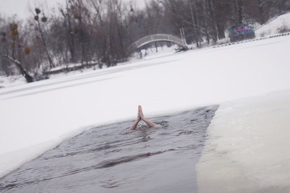 A man plunges into the iced river in Hydropark, a famed Ukrainian swimming spot. Kyiv, Ukraine, January 6, 2026. (Photo: Lucile Brizard) A man plunges into the iced river in Hydropark, a famed Ukrainian swimming spot. Kyiv, Ukraine, January 6, 2026. (Photo: Lucile Brizard)