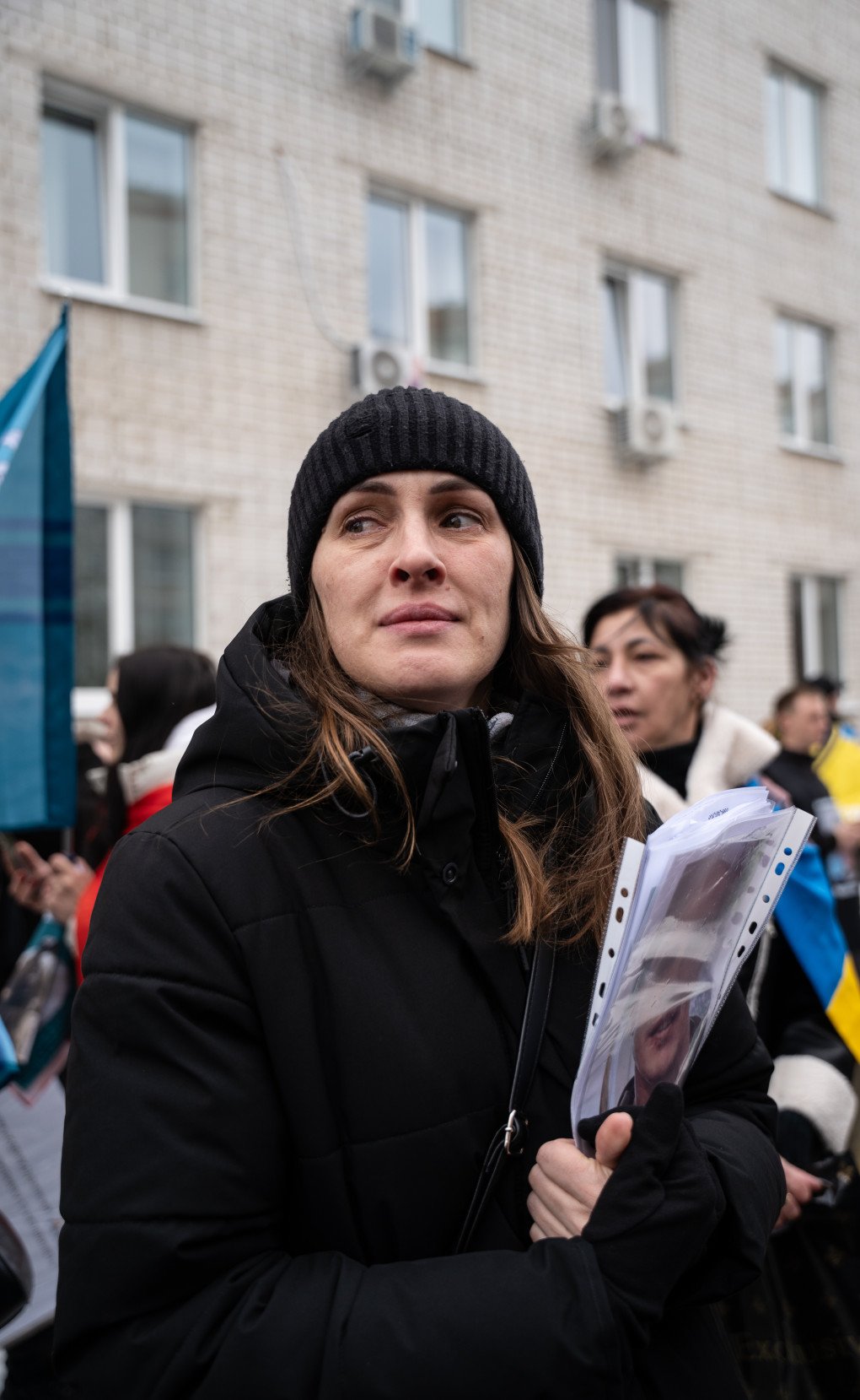 A woman holds the photo of her loved one during the first day of the exchange, March 5, 2026, undisclosed location, Ukraine. Photo by Dmytro Ivanov/UNITED24 Media