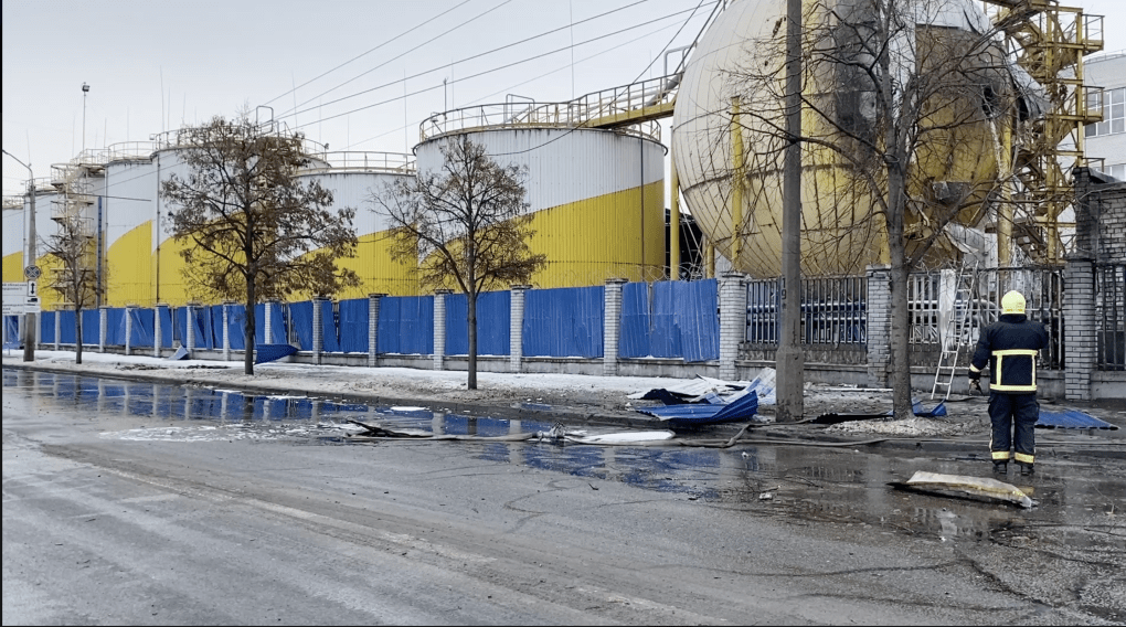 A view of the industrial site from the street, showing the large spherical tanks and the cleanup equipment deployed to manage the 300-ton spill. (Source: State Emergency Service)