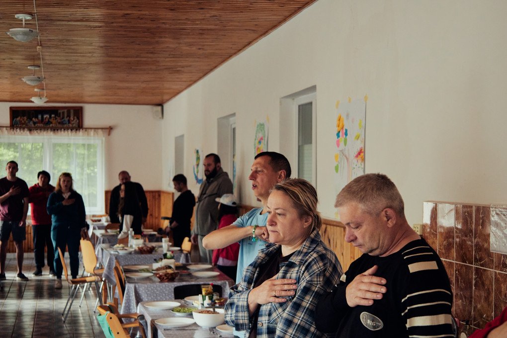 Beneficiaries of “Veteran’s Family” Program, organized by Caritas-Spes Ukraine, sing Ukraine’s national anthem. May 2026, the Zhytomyr region, Ukraine. (Photo: Louis Beaudemont/UNITED24 Media) Beneficiaries of “Veteran’s Family” Program, organized by Caritas-Spes Ukraine, sing Ukraine’s national anthem. May 2026, the Zhytomyr region, Ukraine. (Photo: Louis Beaudemont/UNITED24 Media)