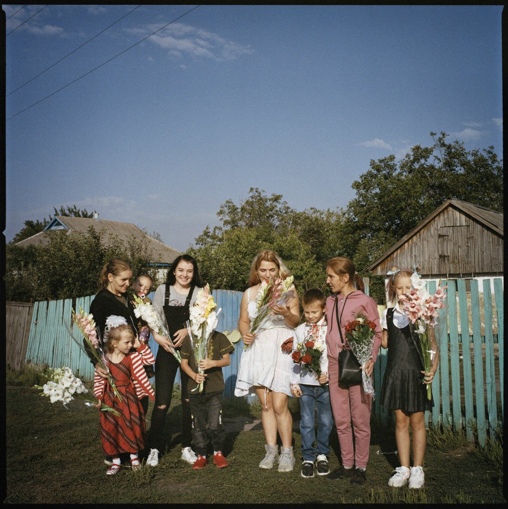 The Hrynyks' extended family gather before the first day of school in the Poltava region, 2024.From the series 5K from the Frontline. (Image: Anastasia Taylor-Lind) The Hrynyks' extended family gather before the first day of school in the Poltava region, 2024.From the series 5K from the Frontline. (Image: Anastasia Taylor-Lind)