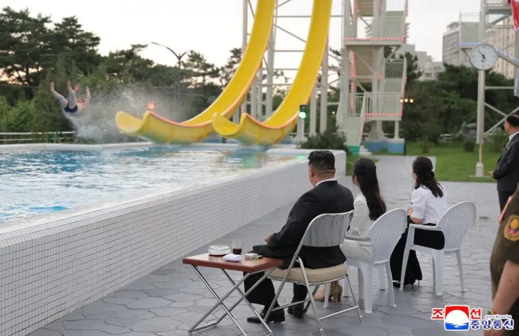 Kim Jong-un and family watch water slide demonstration at Wonsan-Kalma resort opening. (Source: KCNA)
