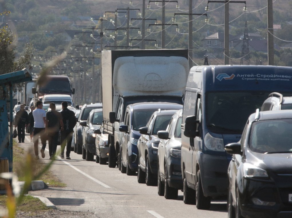 People wait for the ferry in their cars after a truck exploded and heavily damaged the Kerch bridge that links Crimea to Russia, near Kerch, on October 8, 2022. (Photo by AFP via Getty Images) People wait for the ferry in their cars after a truck exploded and heavily damaged the Kerch bridge that links Crimea to Russia, near Kerch, on October 8, 2022. (Photo by AFP via Getty Images)