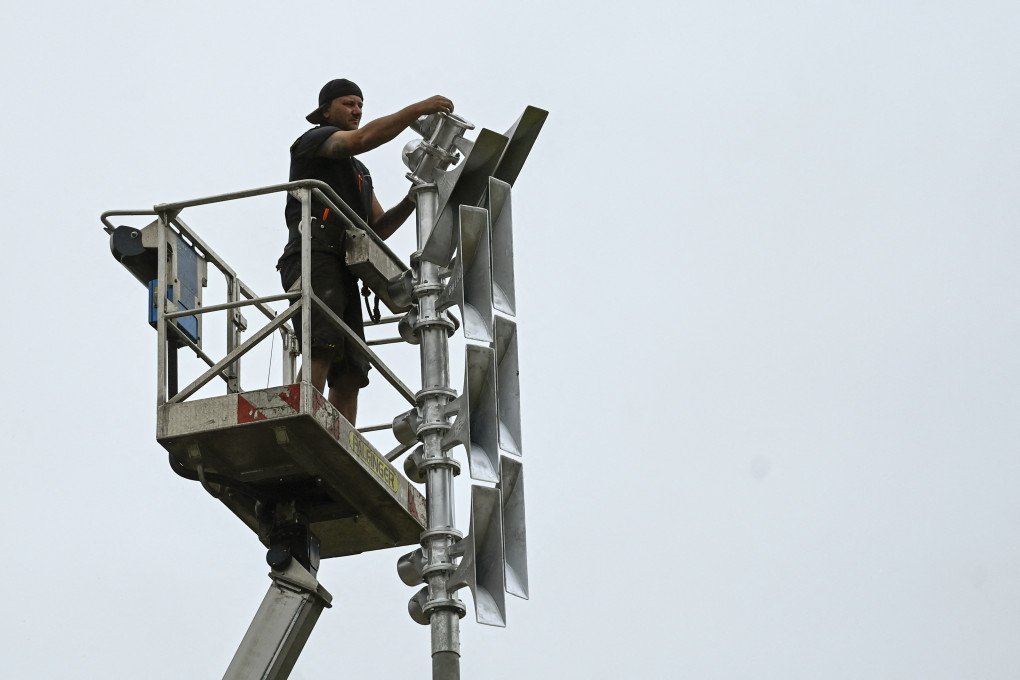 A worker installs sirens July 11, 2022, Rhineland-Palatinate Germany. (Photo by INA FASSBENDERAFP via Getty Images) A worker installs sirens July 11, 2022, Rhineland-Palatinate Germany. (Photo by INA FASSBENDERAFP via Getty Images)