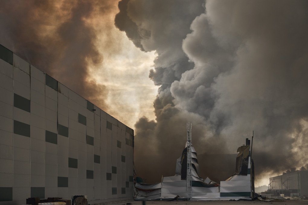 Massive flames and thick smoke rise from burning commercial and food storage warehouses, belonging to major Ukrainian businesses such as Aurora, Fozzy, Nasha Riaba, and Budynok Ihrashok, after a Russian drone attack on August 27, 2026 in Boryspil, Kyiv region, Ukraine. (Photo by Kostiantyn Liberov via Getty Images)