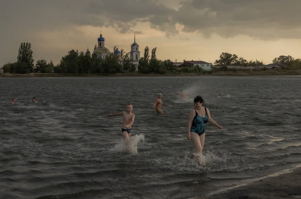 Residents cool off in a river. (Source: Roman Pilipey/Instagram) Residents cool off in a river. (Source: Roman Pilipey/Instagram)
