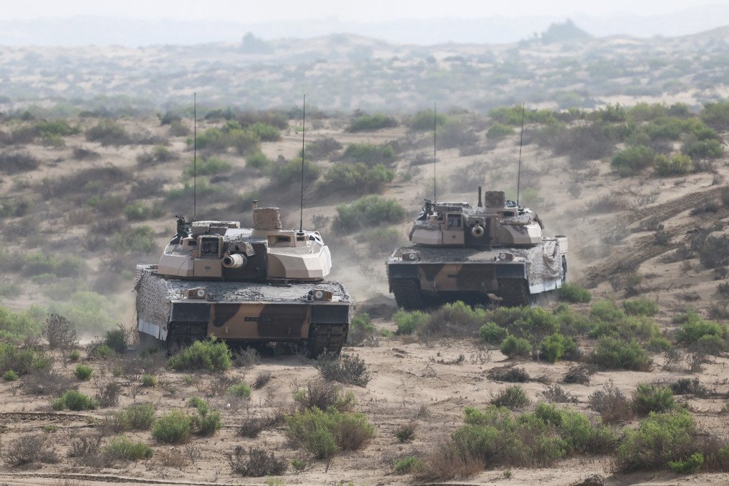 French soldiers from the 5th Tank Regiment manoeuvre Leclerc tanks during a training exercise at a military field in Zayed Military City, near Abu Dhabi, on December 20, 2025. (Source: Getty Images)