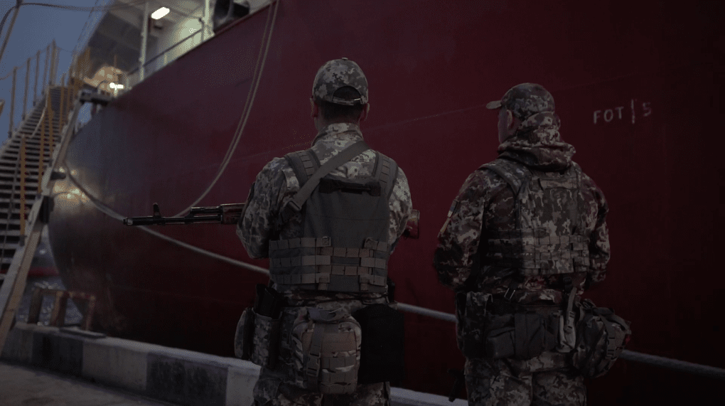Ukrainian serviceman watching over port operations. Photo: Ukrainian Sea Ports Authority (USPA)