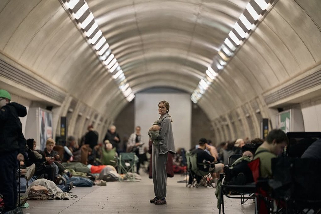 A woman carries a baby in the Kyiv subway station, serving as a shelter during a massive Russian drone and missile strike on Kyiv on July 4, 2025. (Source: libcos) A woman carries a baby in the Kyiv subway station, serving as a shelter during a massive Russian drone and missile strike on Kyiv on July 4, 2025. (Source: libcos)