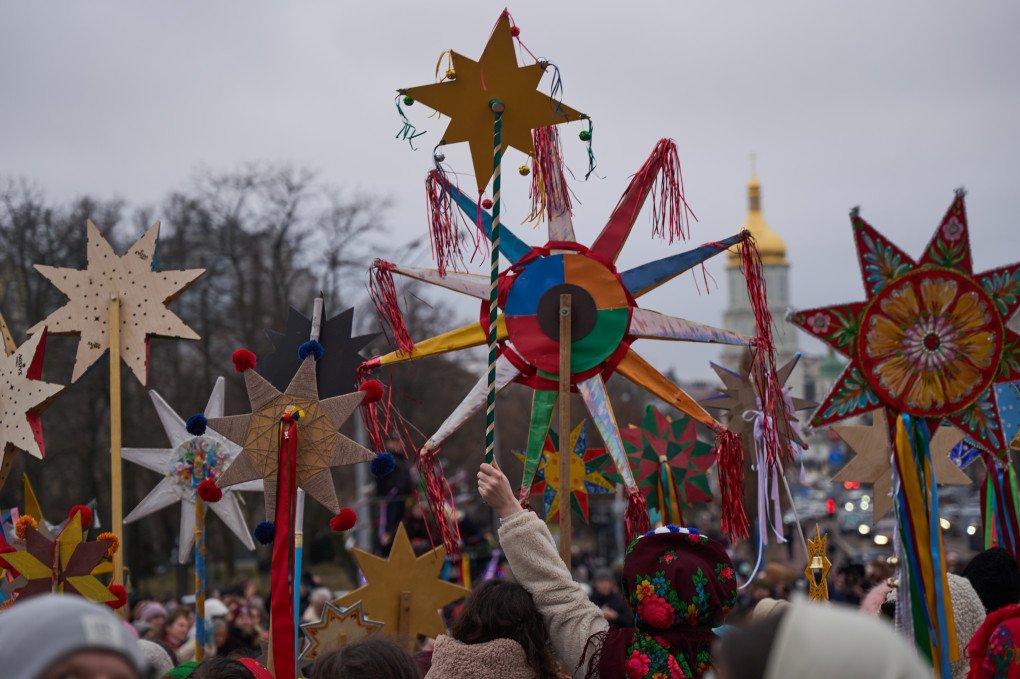 There’s a sea of handmade stars of various colors and sizes, as the procession moves through Kyiv’s historic streets.