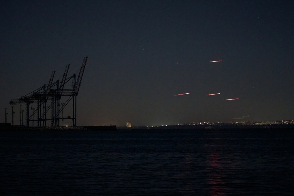 Russian Shahed-type drones attack the area near the port of Odesa during an overnight air assault, as air defense systems engage incoming targets amid Russia's ongoing invasion of Ukraine, on January 1, 2026 in Odesa, Ukraine. (Photo by Kostiantyn Liberov via Getty Images)