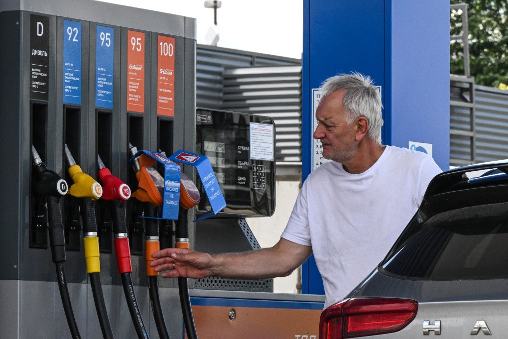 A man refuels a car at a Gazpromneft petrol station in Moscow on June 24, 2026. (Photo by Igor Ivanko via Getty Images)