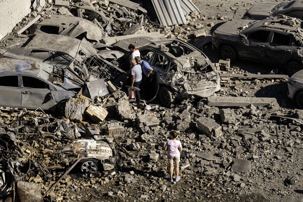 Local residents inspect cars burned in a Russian overnight missile and drone attack in Kyiv, Ukraine, on August 20, 2026. (Photo by Maxym Marusenko via Getty Images) Local residents inspect cars burned in a Russian overnight missile and drone attack in Kyiv, Ukraine, on August 20, 2026. (Photo by Maxym Marusenko via Getty Images)
