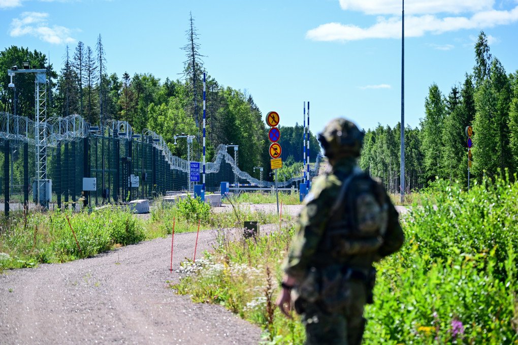 An officer from a special unit of the Finnish Border Guard stands in front of the border fence at a closed border crossing on the Finnish-Russian border on July 16, 2026, at Virolahti, Finland. (Source: Getty Images) An officer from a special unit of the Finnish Border Guard stands in front of the border fence at a closed border crossing on the Finnish-Russian border on July 16, 2026, at Virolahti, Finland.