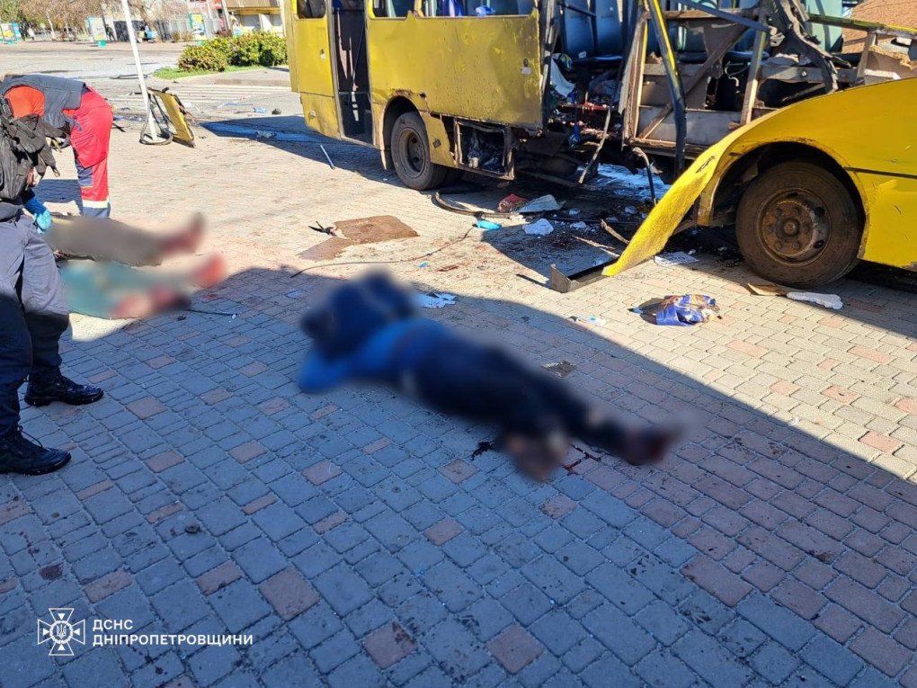 Victims lie near the damaged bus at the site of a Russian drone strike in Nikopol. (Source: Office of the President)