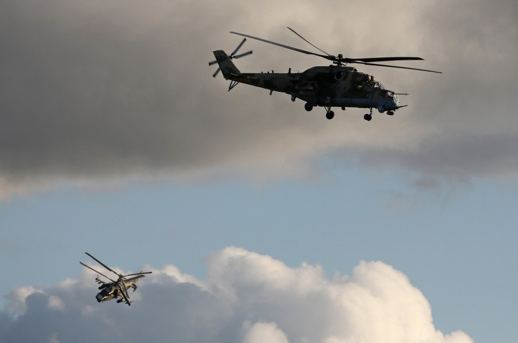 Russian army Kamov Ka-52 'Alligator', left, and Mi-35M 'Hinde E' attack helicopters take part in a live demonstration at the International Military-Technical Forum 'ARMY 2018' at Kubinka airfield in Kubinka, Russia, on Tuesday, Aug. 21, 2018. The event is organised by the Russian Ministry of Defence and combines the exhibition and dynamic demonstration of military equipment capabilities with strong participation of an international audience represented by foreign exhibitors, delegations and visitors. Photographer: Andrey Rudakov/Bloomberg via Getty Images