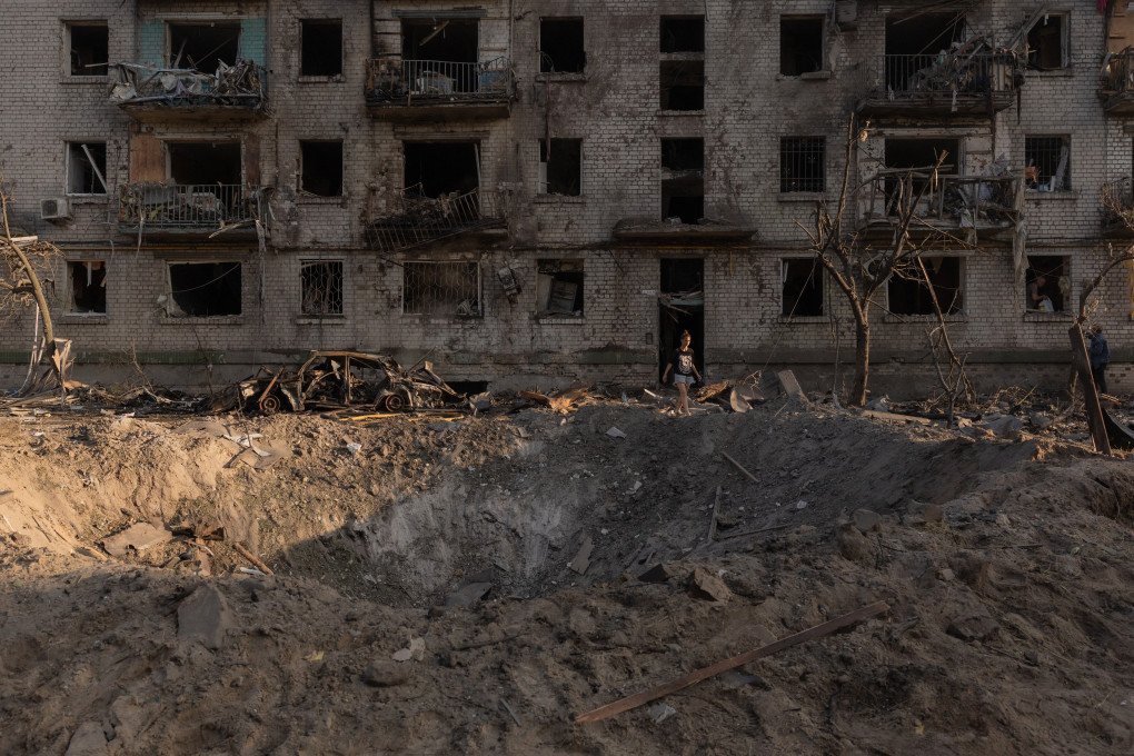 A person walks from a residential building damaged following a Russian air attack on the Ukrainian capital of Kyiv on July 2, 2026, amid the Russian invasion in Ukraine. (Photo by Roman PILIPEY / AFP via Getty Images)