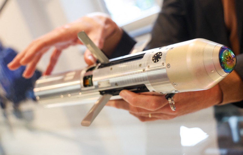An employee holds a miniature of a 70mm rocket during a visit to the Thales production site in Herstal, on October 3, 2025. (Source: Getty Images) An employee holds a miniature of a 70mm rocket during a visit to the Thales production site in Herstal, on October 3, 2025. (Source: Getty Images)