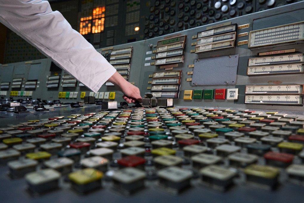 A worker’s hand reaches for the infamous AZ-5 button. Photo: Mykyta Shandyba/UNITED24 Media
