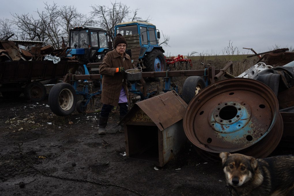 Natalia heads out to feed the family dogs. Photo: Oleksii Filippov Natalia heads out to feed the family dogs. Photo: Oleksii Filippov