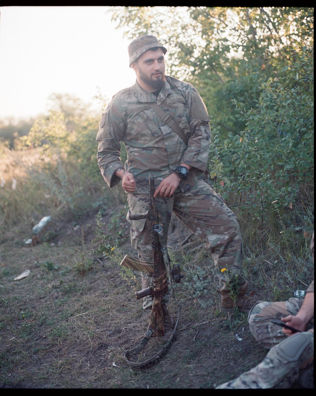 Groot laughs with the rest of his brigade as he waits to be taken to positions. Ukraine, August 2025. Photo by Lucile Brizard/UNITED24 Media.