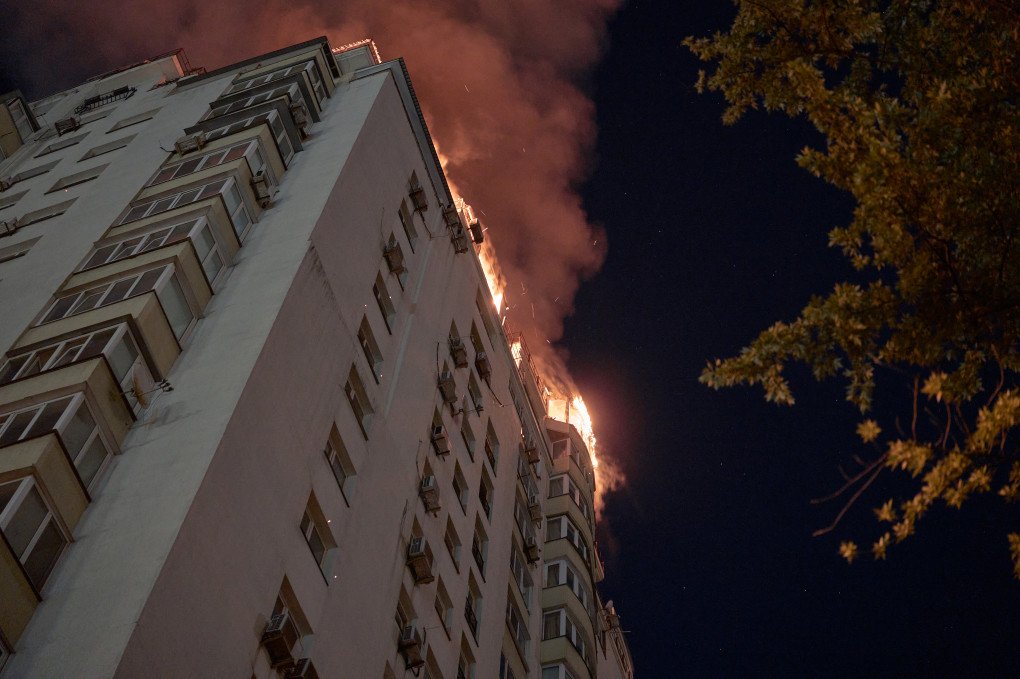 Flames engulf the top floor of a residential building after a Russian missile strike during an overnight missile and drone attack on July 2, 2026 in Kyiv, Ukraine. (Photo by Kostiantyn Liberov/Libkos/Getty Images)