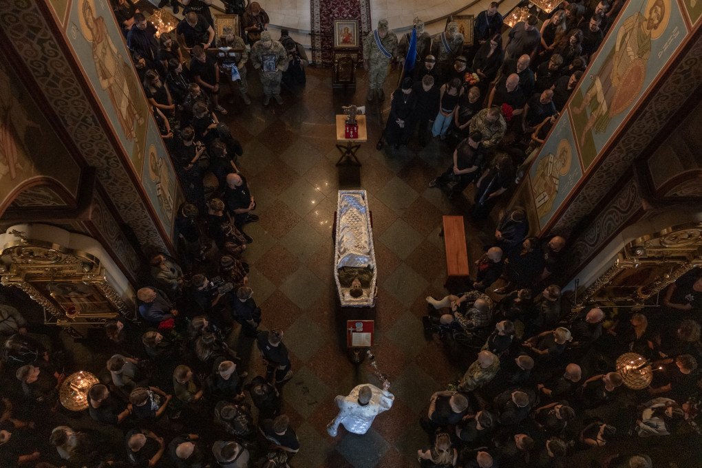 Relatives, friends and others attend a funeral ceremony for Ukrainian serviceman Danylo Smyrnov, callsign "Surfer", a member of the International Legion of Ukraine's Defence Intelligence, who was recently killed in action, at the Saint Michael's Golden-Domed Monastery in Kyiv on September 3, 2026. (Photo by Roman Pilipey via Getty Images)