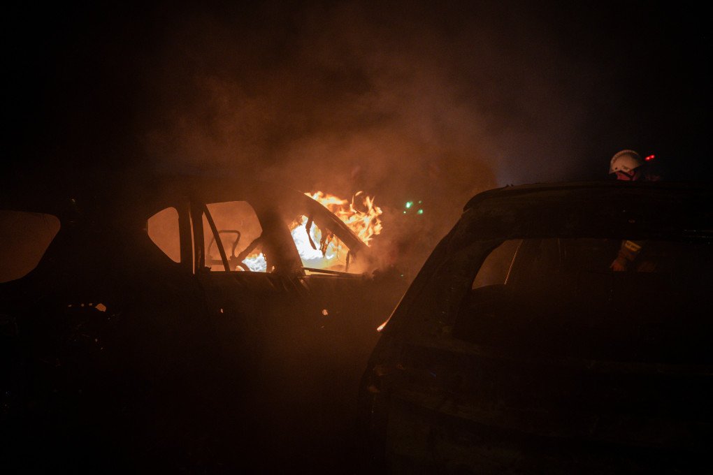 A burning automobile stands near where a civilian victim was killed during a nighttime Russian missile strike on Kyiv. When volunteer paramedics from Medical Crew 13 arrived at the scene, nearly every vehicle in the parking lot was engulfed in flames as first responders searched for survivors. (Photo: Nikita Lisovyi / UNITED24 Media) Burning car at a Kyiv parking lot following a nighttime Russian missile strike, where Medical Crew 13 paramedics searched for survivors.