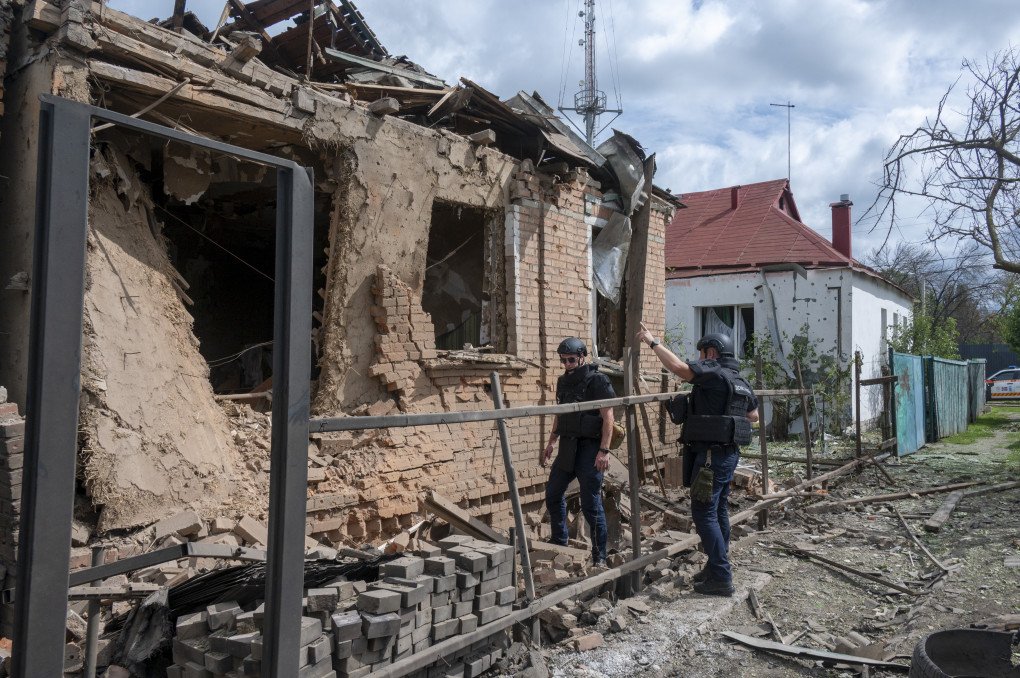 Emergency services operate at the site of a missile strike in a private residential area of Kharkiv, Ukraine, on July 26, 2026. A 40-year-old woman was killed, and 16 others were injured, including her 10-year-old son, who was hospitalized with blast injuries, after Russian forces struck the neighborhood with an S8000 ('Banderole') missile. (Photo by Serhii Masin via Getty Images) Emergency services operate at the site of a missile strike in a private residential area of Kharkiv, Ukraine, on July 26, 2026. A 40-year-old woman was killed, and 16 others were injured, including her 10-year-old son, who was hospitalized with blast injuries, after Russian forces struck the neighborhood with an S8000 ('Banderole') missile. (Photo by Serhii Masin via Getty Images)