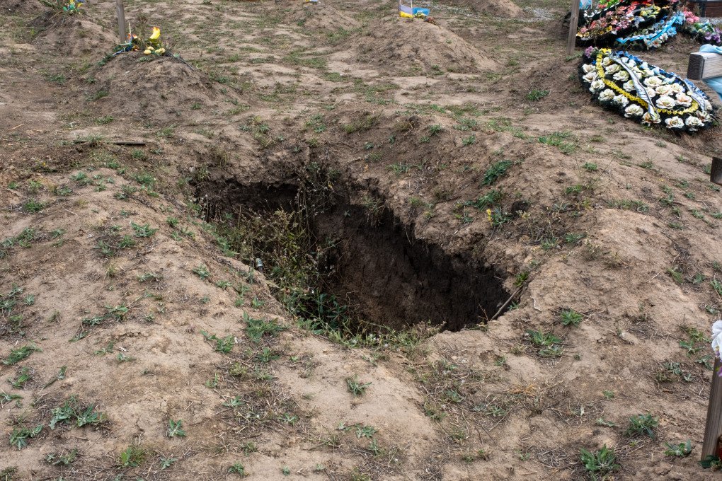 A dug-up grave in a section for unidentified bodies, presumably, this person’s family was finally given closure. (Photo: Daniel Kosoy / UNITED24 Media) 