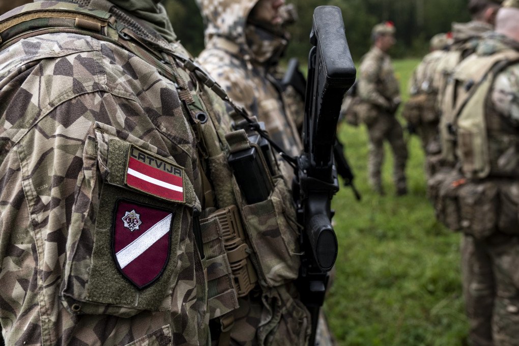 A Latvian soldier attends a briefing during NATO-linked military exercises with British, Latvian, Canadian and Italian forces, in Latvia, on Sunday, Oct. 5, 2025. (Photo: Damian Lemanski/Bloomberg via Getty Images)