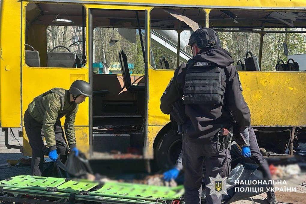 Police and emergency workers inspect the destroyed bus following a drone strike in central Nikopol that targeted civilians. (Source: Office of the President)