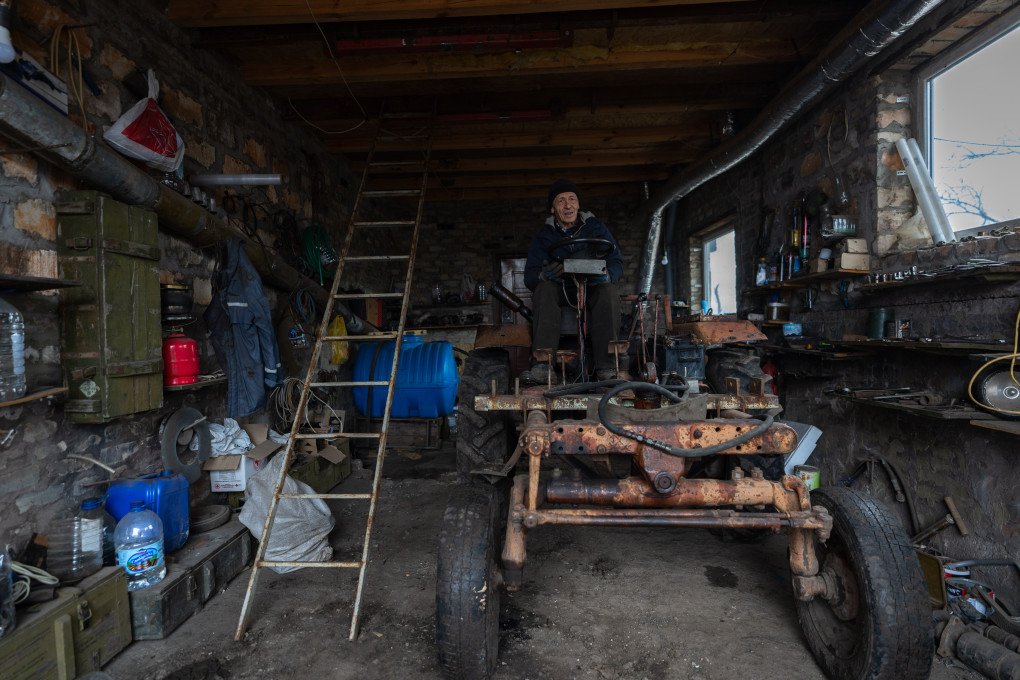 Anatolii sits atop the family’s functioning makeshift tractor. Photo: Oleksii Filippov Anatolii sits atop the family’s functioning makeshift tractor. Photo: Oleksii Filippov