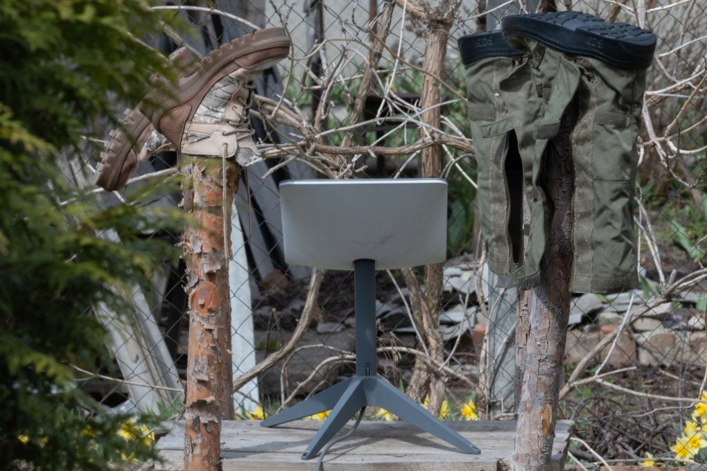 An antenna of the Starlink satellite-based broadband system stands in a yard next to the wooden posts on which shoes are dried on April 7, 2024, in Kupiansk, Ukraine. (Source: Getty Images) An antenna of the Starlink satellite-based broadband system stands in a yard next to the wooden posts on which shoes are dried on April 7, 2024, in Kupiansk, Ukraine. (Source: Getty Images)