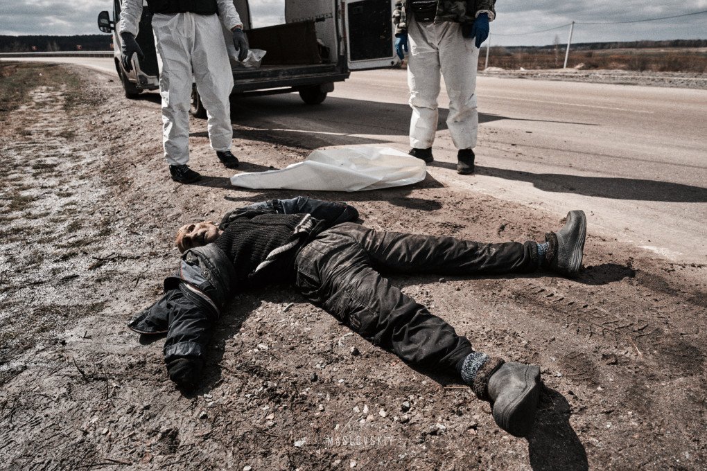 A civilian killed by Russian forces lies on a street in Bucha, Ukraine, where his body remained for nearly a week before it could be recovered following the town’s liberation. (Photo: Ruslan Maslovskiy)