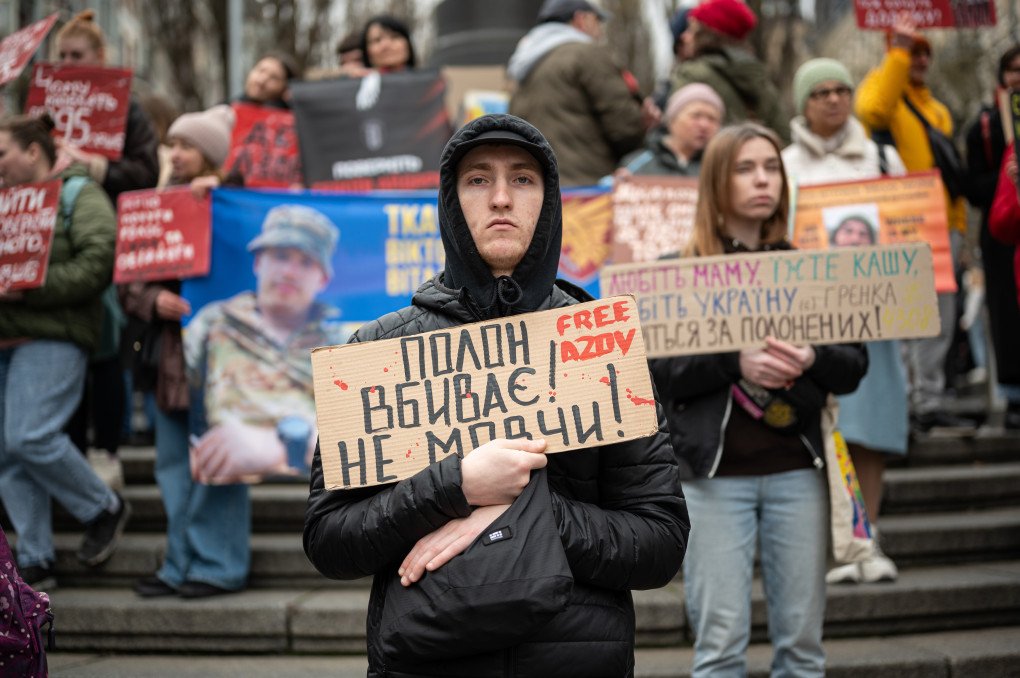 KYIV, APRIL 6, 2025: A man holds a sign reading “Captivity kills. Don’t keep silence” during a rally in Kyiv, Ukraine. The protest was part of a nationwide movement to demand the release of Ukrainian prisoners of war, including members of the Azov Brigade, who have been held by Russia since 2022. (Photo: Danylo Antoniuk via Getty Images)
