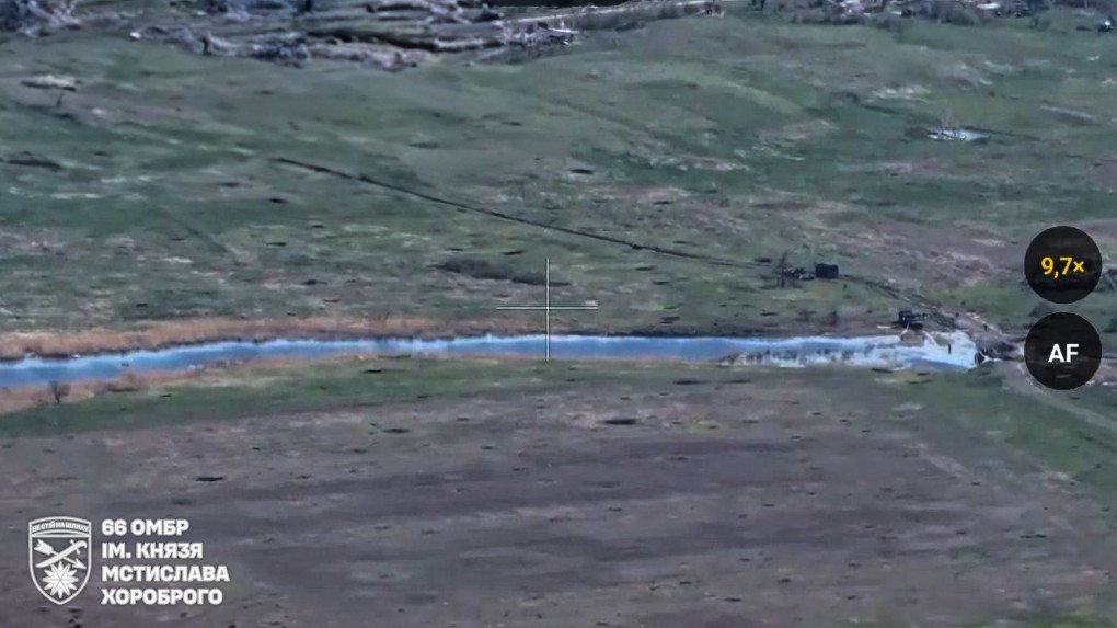 Russian forces work on removing the wreckage of a rare Russian engineering vehicle used to deploy temporary roadways, KRVD in the Chornyi Zherebets river after Ukrainian FPV drone strikes, April 20, 2025. (Source: 66th Mechanized Brigade) Russian forces work on removing the wreckage of a rare Russian engineering vehicle used to deploy temporary roadways, KRVD in the Chornyi Zherebets river after Ukrainian FPV drone strikes, April 20, 2025. (Source: 66th Mechanized Brigade)