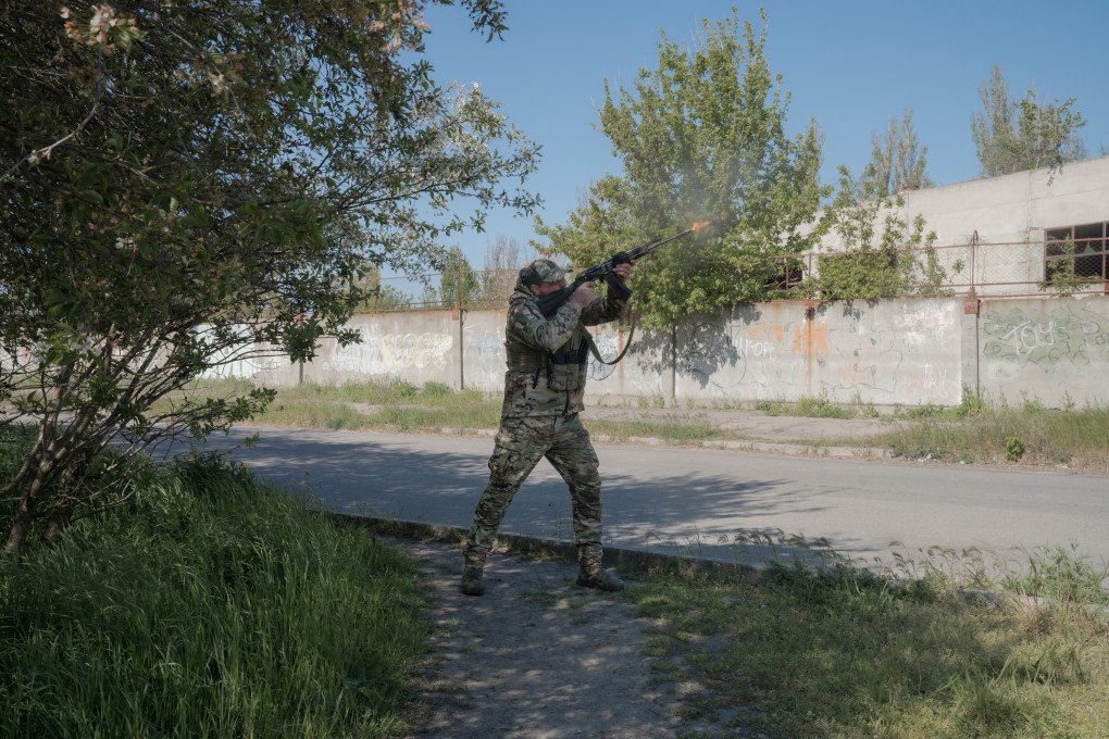 Serhii, armed only with a Kalashnikov fitted with iron sights, shoots down a Russian Molniya drone. Kherson, Ukraine, May 2026. Photo: Joshua Olley / UNITED24 Media.
